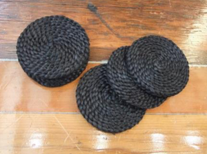 Our collection of eco-chic jute drink coasters look glorious on their own or with our selection of placemats. round black coaster. Black jute coaster.